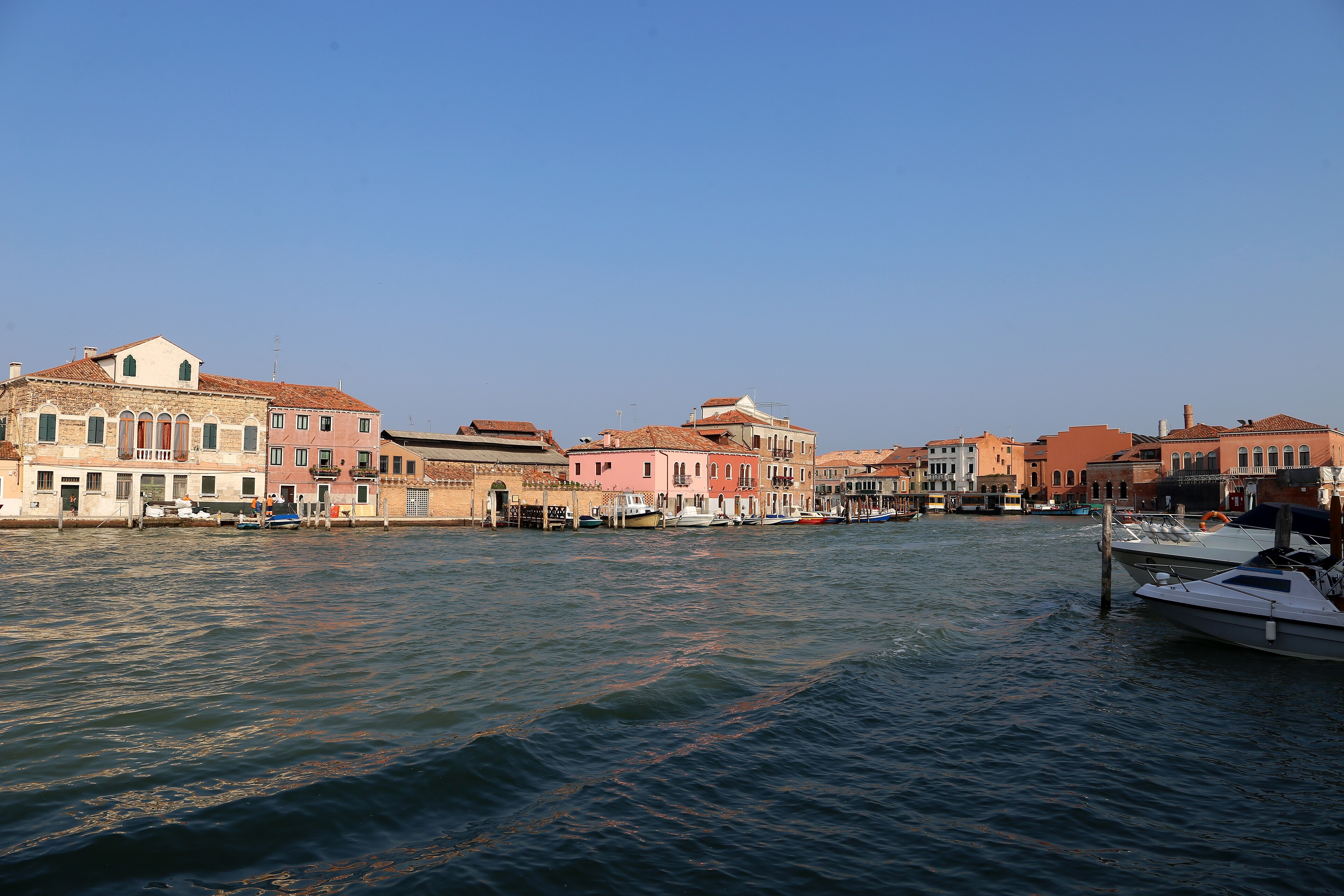 The canal grande of Murano, the glass island, with workshop buildings on both banks