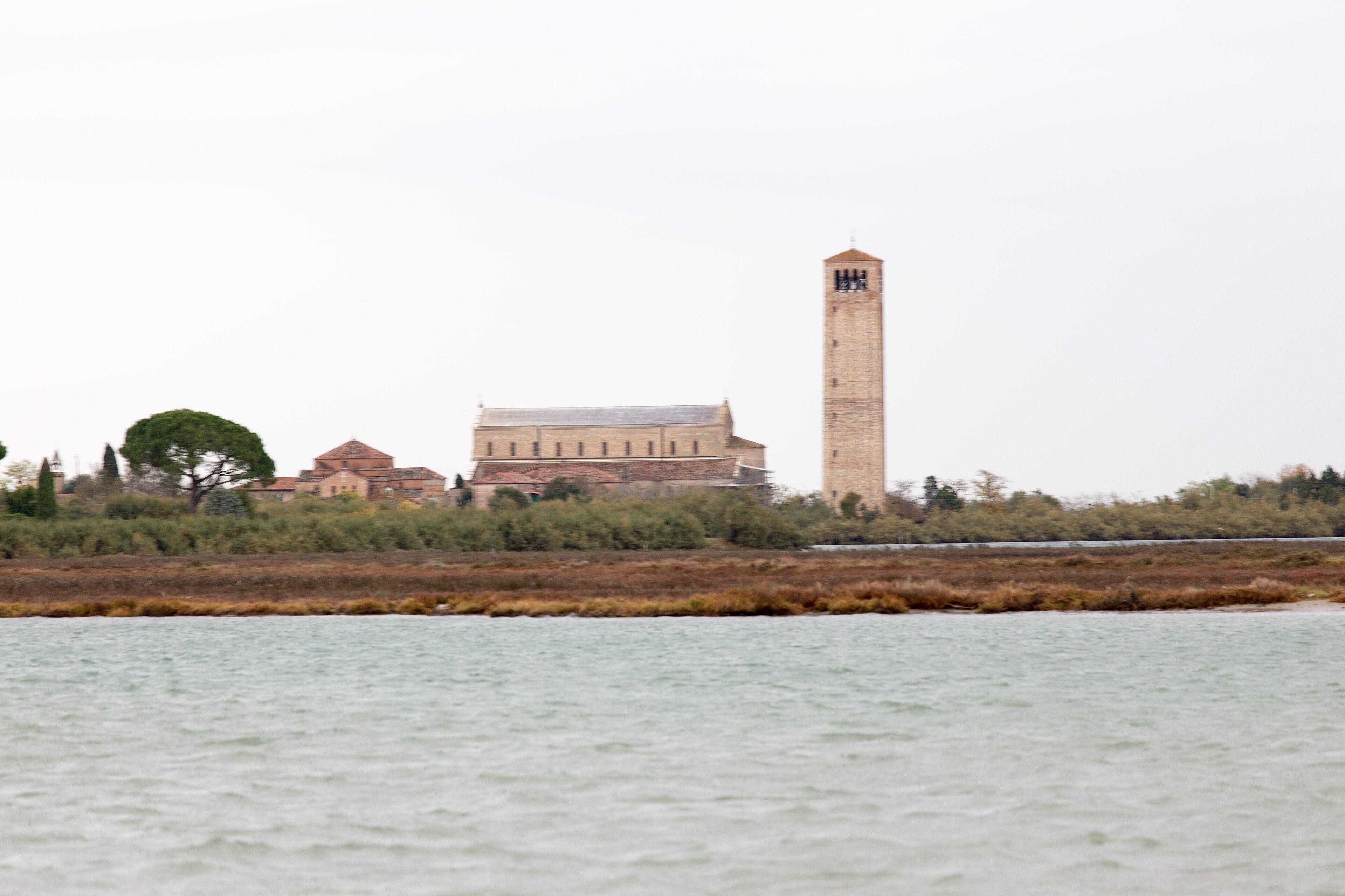 The basilica of Santa Maria Assunta at Torcello, seen across the open fields of the island